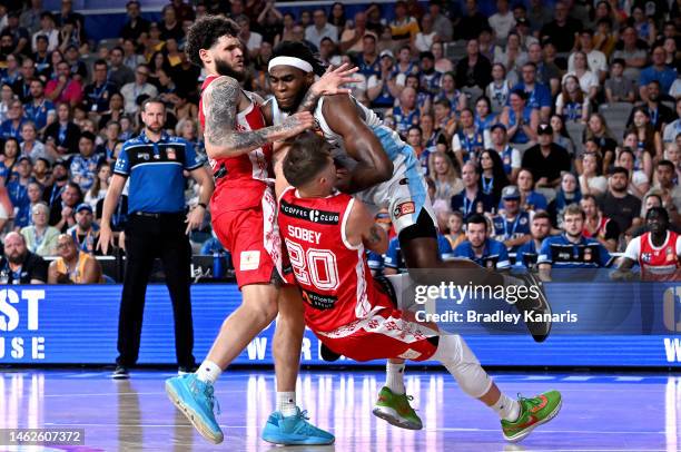 Jarrell Brantley of the Breakers collides with Nathan Sobey and Tyler Johnson of the Bullets during the round 18 NBL match between Brisbane Bullets...
