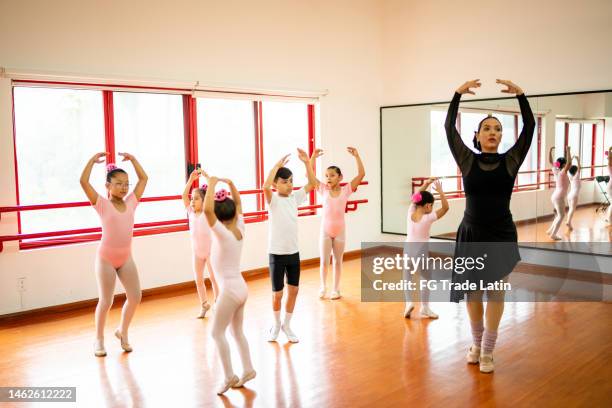 ballet class dancing at the dance studio - boy ballet stock pictures, royalty-free photos & images