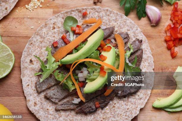 preparing burritos - steak rind bildbanksfoton och bilder