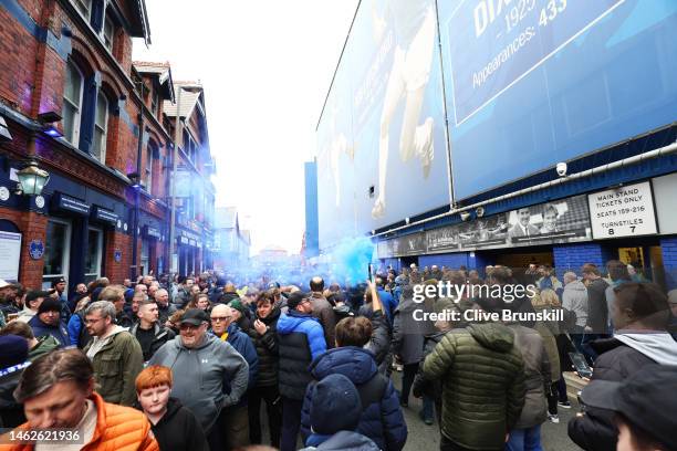 Everton fans are seen protesting against club owners outside the stadium prior to the Premier League match between Everton FC and Arsenal FC at...