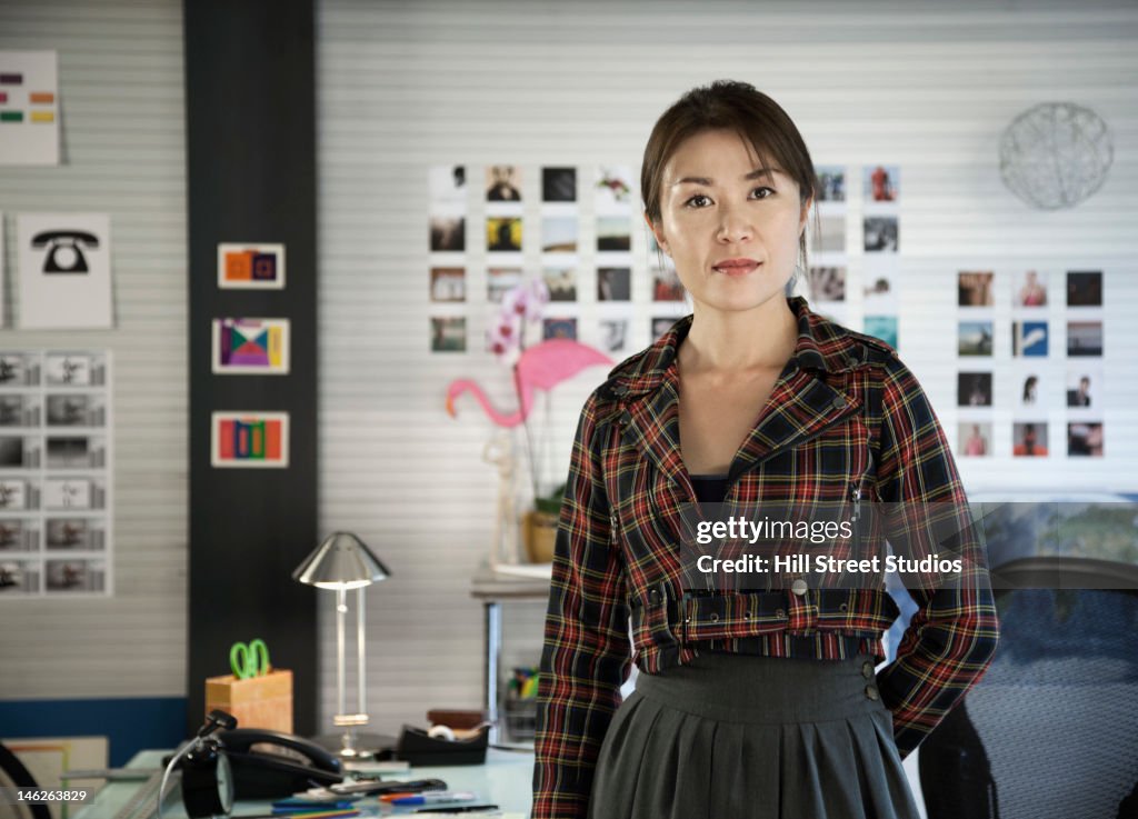 Japanese businesswoman standing in office