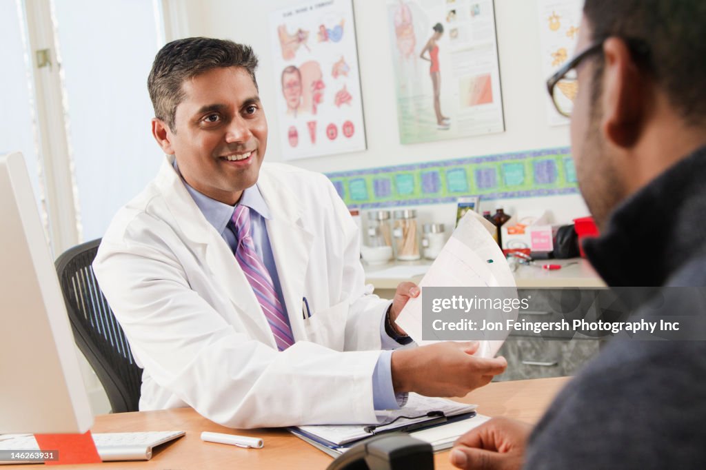 Doctor talking to patient in doctor's office