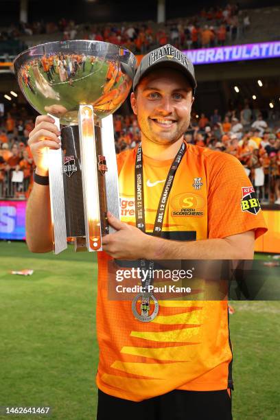 Josh Inglis of the Scorchers poses with the BBL trophy after winning the Men's Big Bash League Final match between the Perth Scorchers and the...