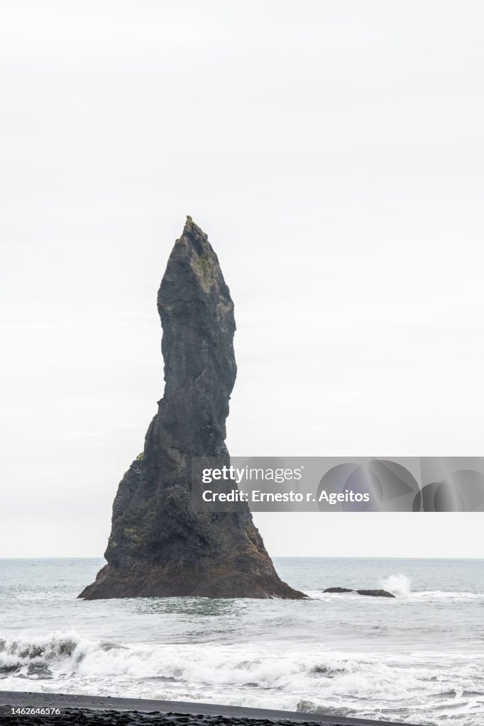Háidrangur (also called Mjóidrangur or Skessudrangur) basalt column at Reynisfjara Black Sand Beach, Iceland