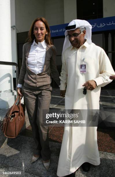 Veronique Robert , mother of a 15-year-old French-Swiss teenager, leaves with lawyer Hussein Ali following the hearing in trial of two of three...