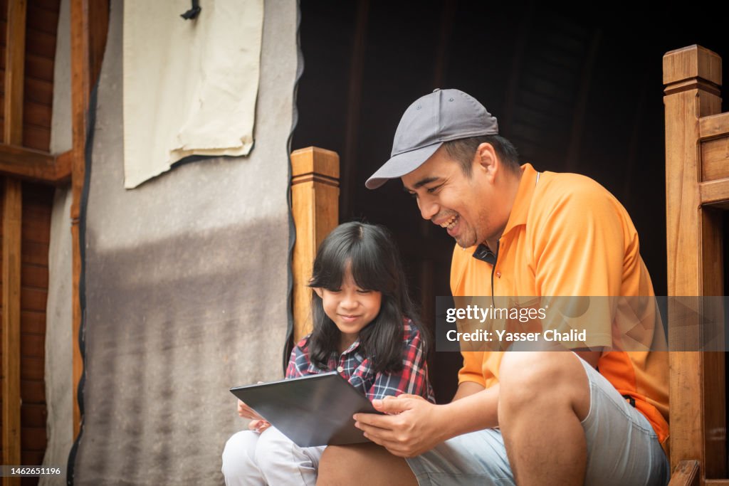 Father Log Father And Daughter Using Laptop In A Log Cabin High-Res Stock Photo ...