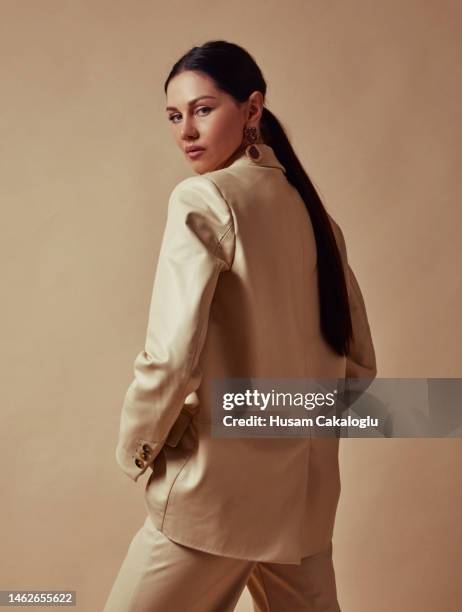 beautiful woman in a leather suit, looking masculine. - estilo imagens e fotografias de stock