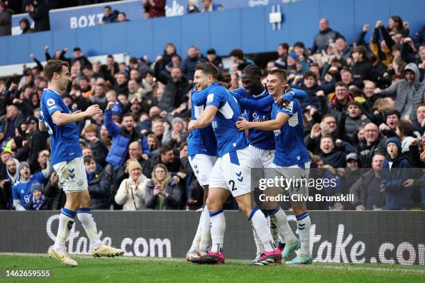 James Tarkowski of Everton celebrates with team mates after scoring their team's first goal during the Premier League match between Everton FC and...