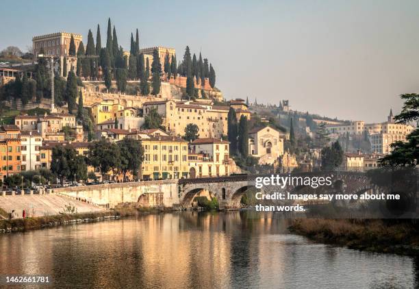 a beautiful view of historic old verona, its bridge and the adige river - adige stock pictures, royalty-free photos & images