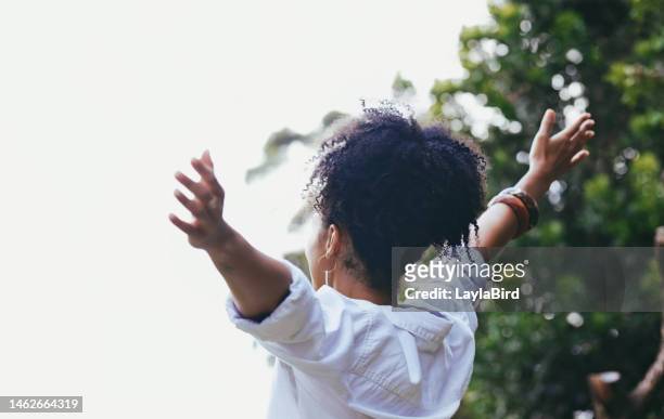 happy, black woman and freedom with arms out for fresh air, relaxation or breathing in the nature outdoors. african american female enjoying holiday vacation, travel or trip in the countryside - relief emotion stock pictures, royalty-free photos & images