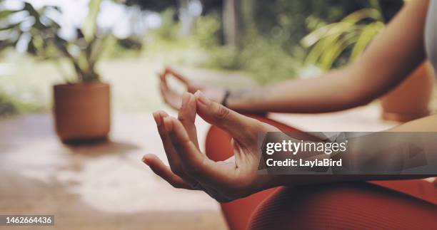 mudra hands, woman and yoga meditation for mental health, freedom and energy in garden, park and zen. closeup girl, fingers and meditate in lotus outdoors for chakra wellness, hope and calm mindset - chakras stock pictures, royalty-free photos & images