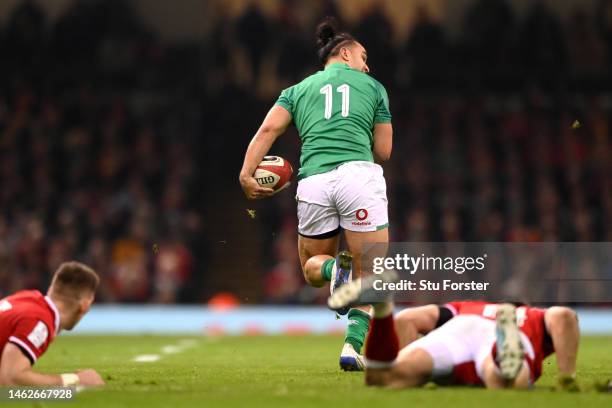 James Lowe of Ireland intercepts a pass to go on to score their side's third try during the Six Nations Rugby match between Wales and Ireland at...