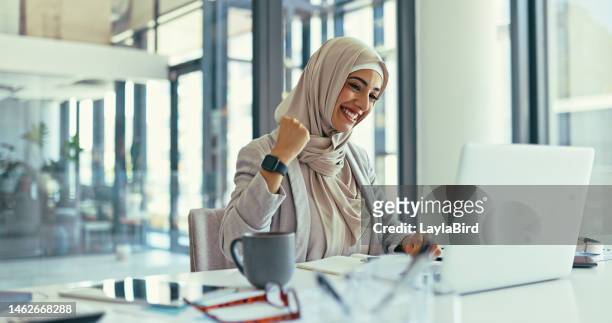 office laptop, excited celebration and muslim woman finish review of finance portfolio, stock market or investment. online crypto trading, success or islamic trader with nft, forex or profit - good news stock pictures, royalty-free photos & images