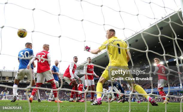 James Tarkowski of Everton scores their sides first goal past Aaron Ramsdale of Arsenal during the Premier League match between Everton FC and...