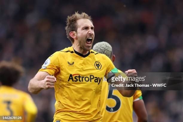 Craig Dawson of Wolverhampton Wanderers celebrates after scoring the team's second goal during the Premier League match between Wolverhampton...