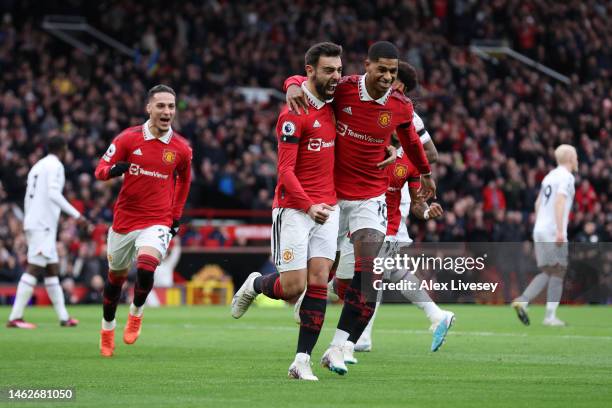 Bruno Fernandes of Manchester United celebrates with team mate Marcus Rashford after scoring their sides first goal during the Premier League match...