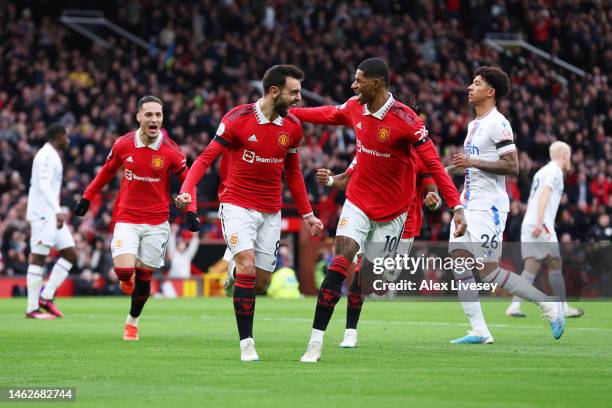 Bruno Fernandes of Manchester United celebrates with team mate Marcus Rashford after scoring their sides first goal during the Premier League match...