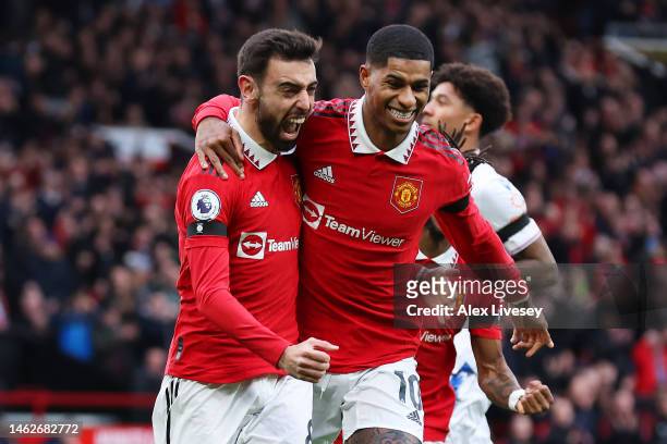 Bruno Fernandes of Manchester United celebrates with team mate Marcus Rashford after scoring their sides first goal during the Premier League match...
