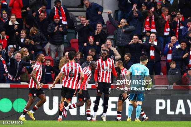 Bryan Mbeumo of Brentford celebrates with teammates after scoring the team's second goal during the Premier League match between Brentford FC and...