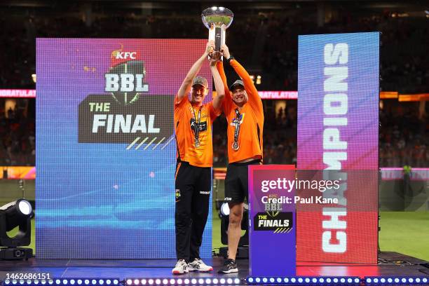 Ashton Turner and Adam Voges of the Scorchers hold the BBL Championship trophy aloft after winning the Men's Big Bash League Final match between the...