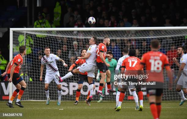 Allan Campbell of Luton Town challenges Phil Jagielka of Stoke City during the Sky Bet Championship match between Luton Town and Stoke City at...