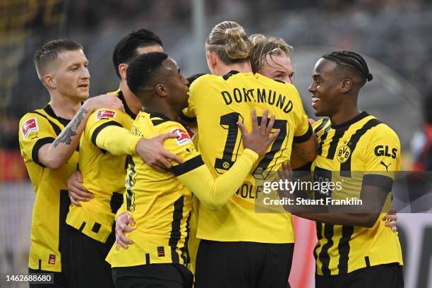 Julian Brandt of Borussia Dortmund celebrates with team mates after scoring their sides fourth goal during the Bundesliga match between Borussia...