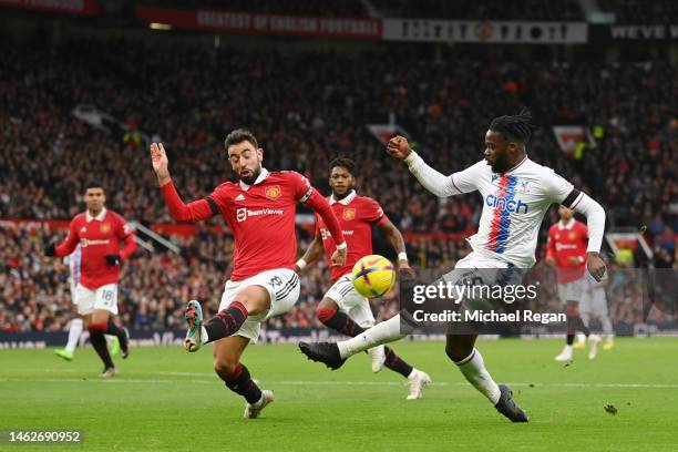 Jeffrey Schlupp of Crystal Palace has a shot blocked by Bruno Fernandes of Manchester United during the Premier League match between Manchester...