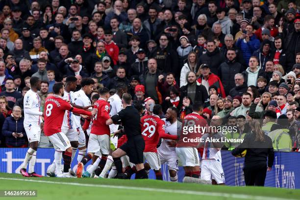 Casemiro of Manchester United clashes with Will Hughes of Crystal Palace leading to a red card decision during the Premier League match between...