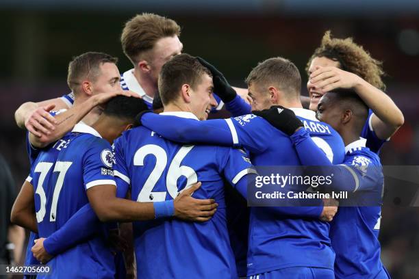 Dennis Praet of Leicester City celebrates with team mates after scoring their sides fourth goal during the Premier League match between Aston Villa...