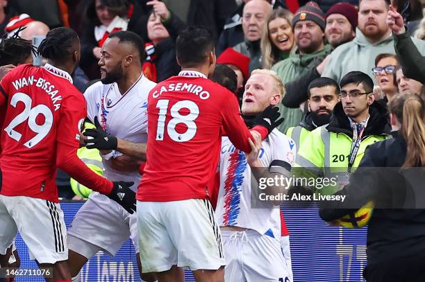 Casemiro of Manchester United clashes with Will Hughes of Crystal Palace leading to a red card decision during the Premier League match between...