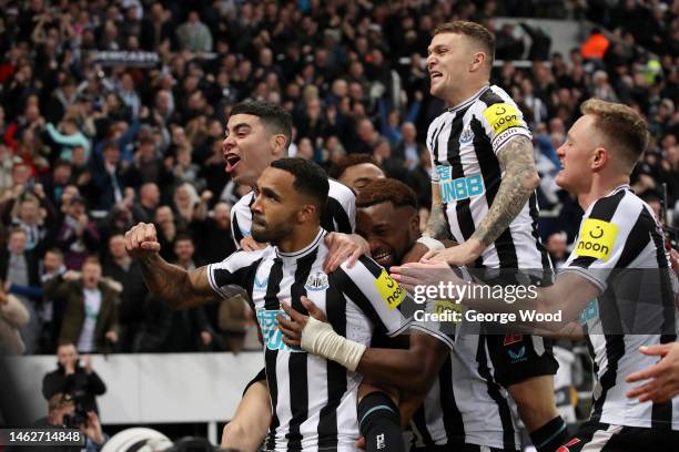 Callum Wilson of Newcastle United celebrates with team mates after scoring their sides first goal during the Premier League match between Newcastle...