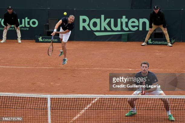 Dan Evans and Neal Skupski of Great Britain play against Sebastian Cabal and Robert Farah of Colombia during the doubles match as part of Round 1 of...