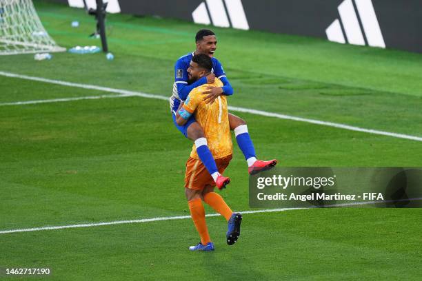 Al Hilal players celebrate after the team's victory in the penalty shoot out during the FIFA Club World Cup Morocco 2022 2nd Round match between...