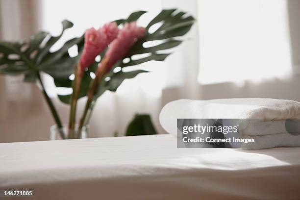 empty massage table - massage table stock pictures, royalty-free photos & images