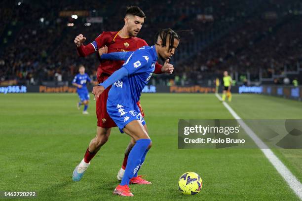 Tyronne Ebuehi of Empoli FC is challenged by Lorenzo Pellegrini of AS Roma during the Serie A match between AS Roma and Empoli FC at Stadio Olimpico...