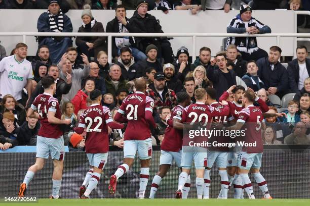 Lucas Paqueta of West Ham United celebrates with team mates after scoring their sides first goal during the Premier League match between Newcastle...