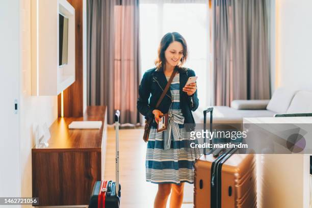 tourist in hotel room flight reservations - hotel poland stock pictures, royalty-free photos & images