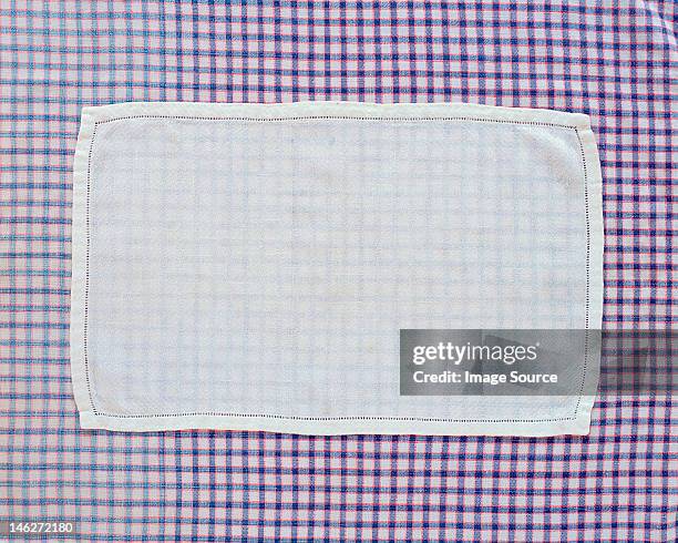 close up of doily on checked table cloth - doily stock pictures, royalty-free photos & images