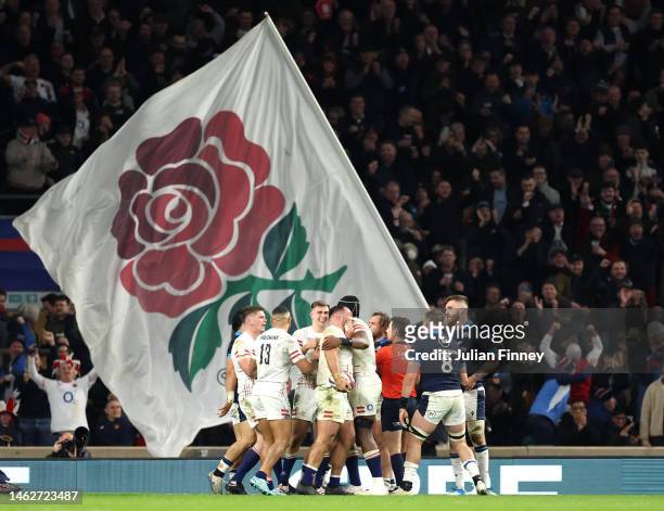 Ellis Genge of England celebrates with teammates scoring their sides third try during the Six Nations Rugby match between England and Scotland at...