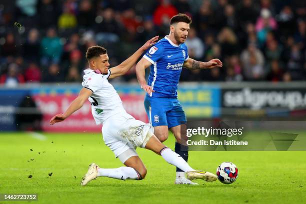 Nathan Wood of Swansea battles for the ball with Scott Hogan of Birmingham during the Sky Bet Championship between Swansea City and Birmingham City...