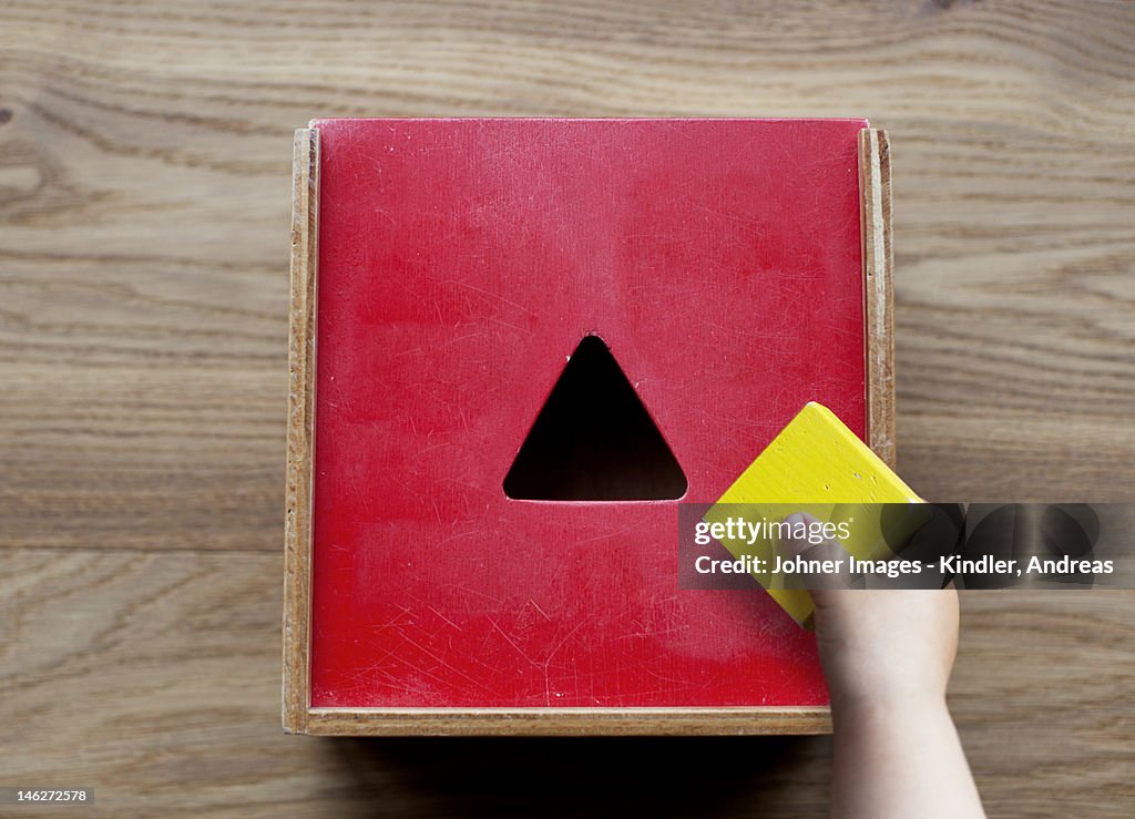 Boy playing with building blocks