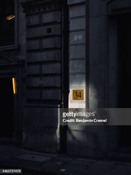Beam of light illuminates the number 34 on Threadneedle Street on February 3, 2023 in London, England. Today, the Bank of England upped its base...