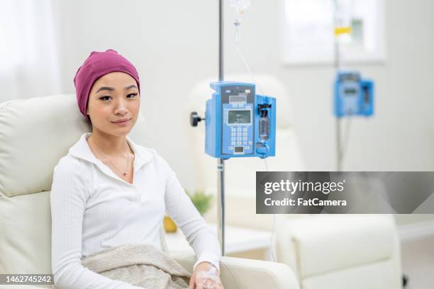 asian woman receiving chemotherapy - chemotherapy stock pictures, royalty-free photos & images