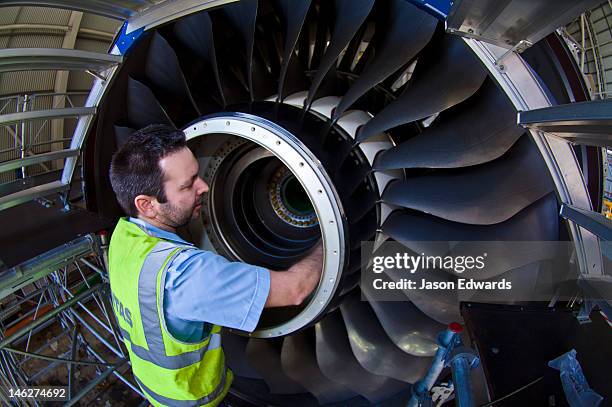 a jet airliner turbofan engine repaired by an aeronautical engineer. - production crew stock pictures, royalty-free photos & images