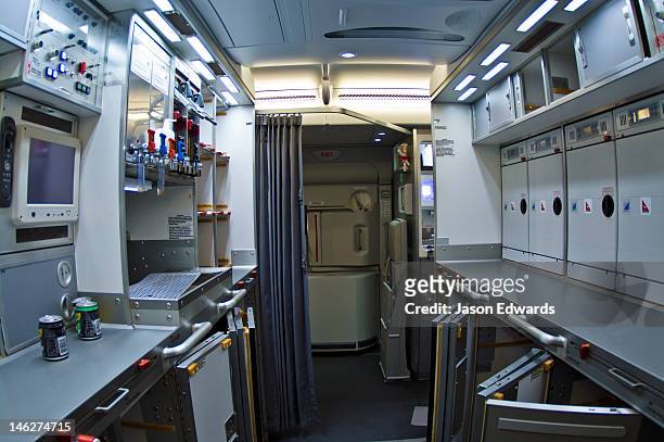 a modern galley kitchen in a jet airliner with storage compartments. - vehicle interior bildbanksfoton och bilder