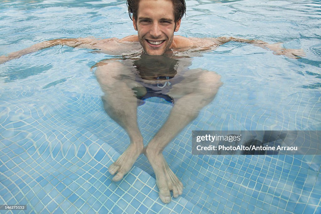 Young man in swimming pool