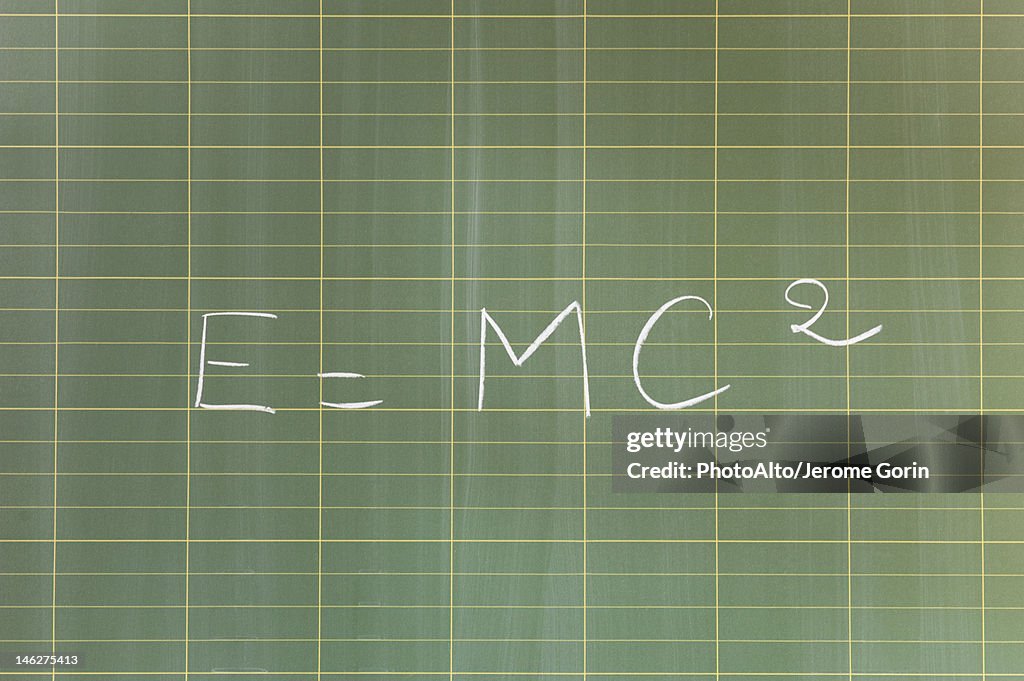 Mass-energy equivalence formula (E = mc2) written on blackboard