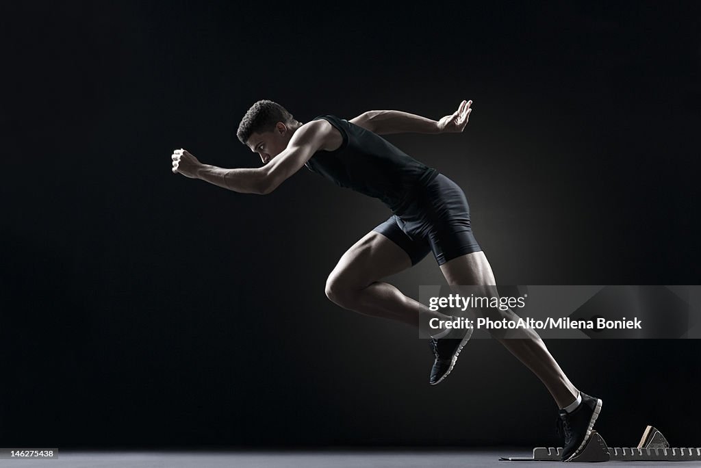 Runner leaving starting block