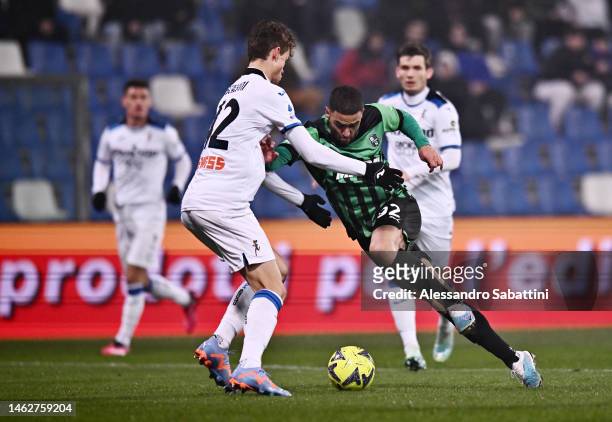 Gregoire Defrel of US Sassuolo battles for possession with Giorgio Scalvini of Atalanta BC during the Serie A match between US Sassuolo and Atalanta...