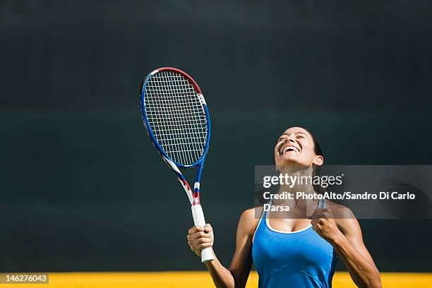 young female tennis player cheering, portrait - tennis woman photos et images de collection